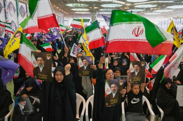 Government supporters in Iran with flags.