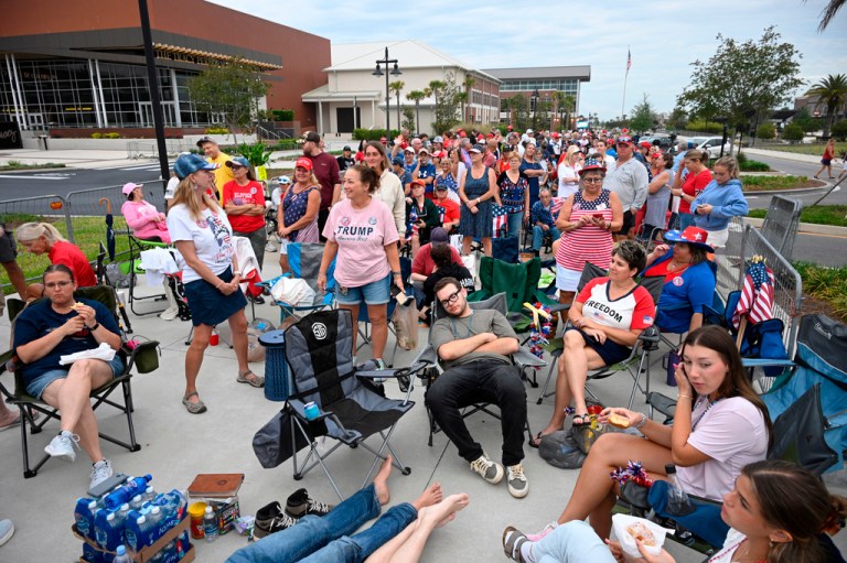 Supporters wait in line before a visit by President Donald Trump.