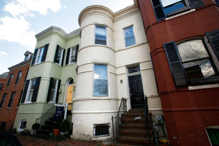 A tan row-house that was home to Albrecht Muth, 47, and Viola Drath, 91, a German journalist and socialite, in the Georgetown neighborhood of Washington (Feb. 23, 2012, file photo). Muth, charged with killing his socialite wife in Washington's fashionable Georgetown neighborhood remains mentally incompetent to stand trial. That's the assessment of doctors who interviewed Albrecht Muth last week. (AP Photo/Jacquelyn Martin)