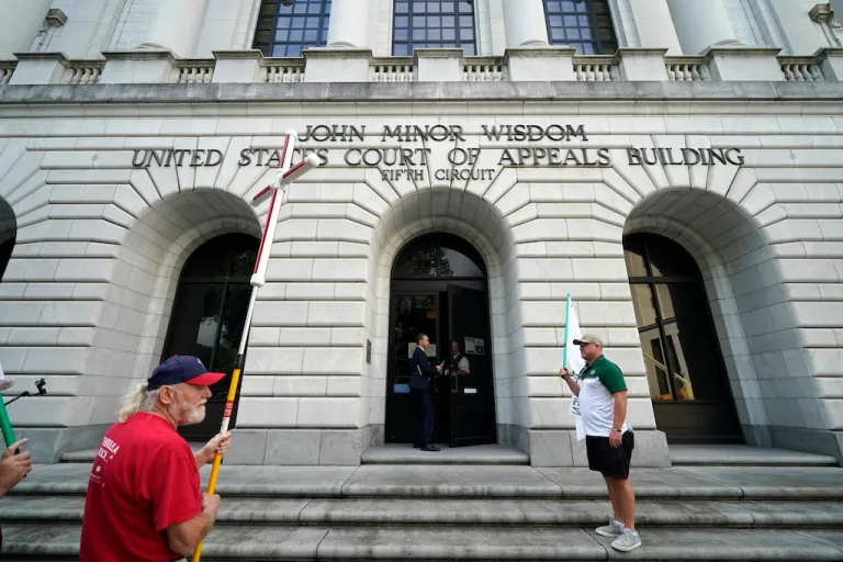 Tony Spell, pastor of the Life Tabernacle Church of Central City, La., waits with supporters outside the Fifth Circuit Court of Appeals in New Orleans, Monday, June 7, 2021. (AP Photo/Gerald Herbert)