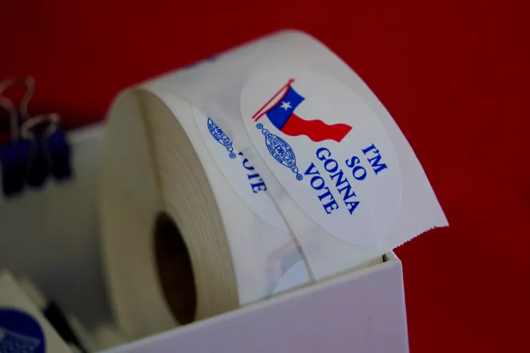 Voting stickers are seen at a political event in Texas.