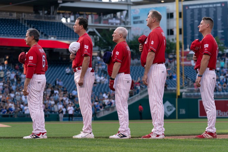 Members of The Republican team listen to the national anthem before the game against Democrats during the Annual Congressional Baseball Game