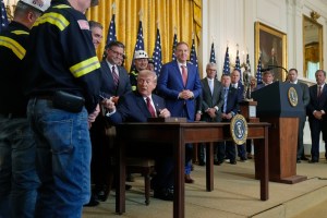 Trump uses wartime powers to spend $700 million to boost coal plants and exports