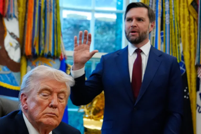 President Donald Trump listens as Vice President JD Vance speaks in the Oval Office.