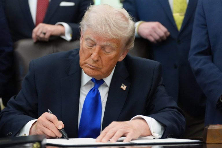 President Donald Trump signs an executive order regarding retirement savings in the Oval Office of the White House, Thursday, April 30, 2026, in Washington. (AP Photo/Alex Brandon)