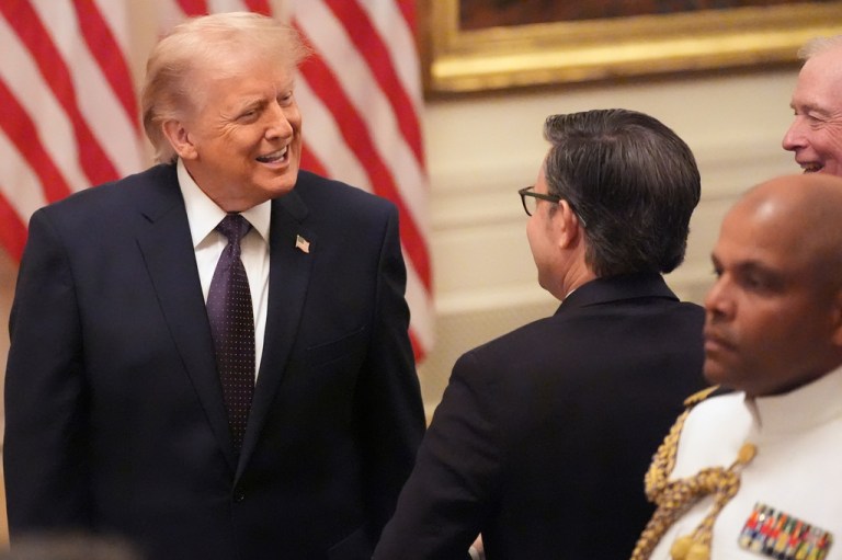 President Donald Trump, from left, speaks with House Speaker Mike Johnson, R-La., and former Vice President Dan Quayle during the swearing in of Kevin Warsh as Chairman of the Federal Reserve in the East Room of the White House, Friday, May 22, 2026, in Washington. (AP Photo/Alex Brandon)