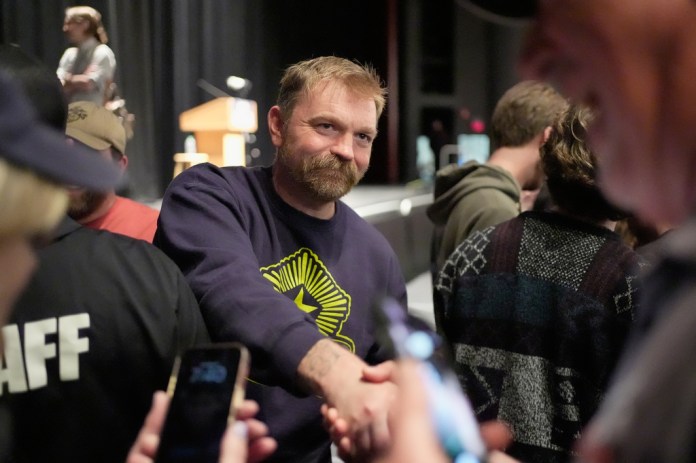 Graham Platner, Democratic candidate for U.S. Senate, greets supporters after speaking at an event hosted by Sen. Bernie Sanders in Orono, Maine, Sunday, May 24, 2026