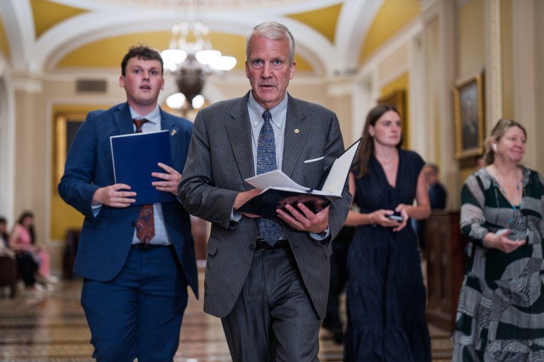 Sen. Dan Sullivan (R-AK) heads to a closed-door meeting with fellow Republicans.