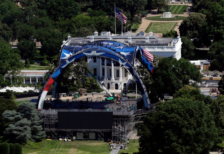 Workers continue building the cage for a future UFC fight on the South Lawn in front of the White House.