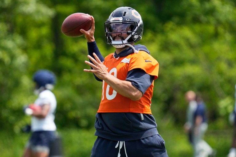 Chicago Bears quarterback Caleb Williams warms up during the NFL football team's practice Wednesday, June 3, 2026, in Lake Forest, Ill.