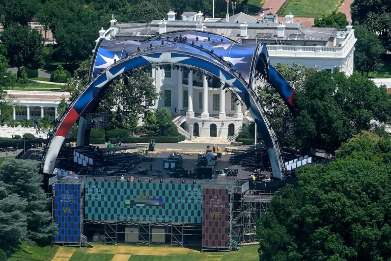 Workers continue building the stage for a future UFC fight on the South Lawn of the White House in Washington, Sunday, June 7, 2026. (AP Photo/Rod Lamkey, Jr.)