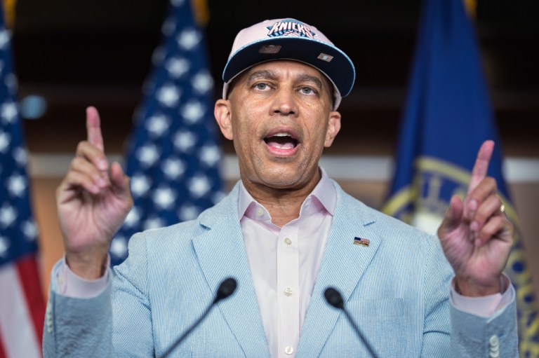 House Minority Leader Hakeem Jeffries, D-N.Y., meets with reporters while wearing a cap for the New York Knicks NBA basketball team on Capitol Hill in Washington, Monday, June 8, 2026. (AP Photo/J. Scott Applewhite)