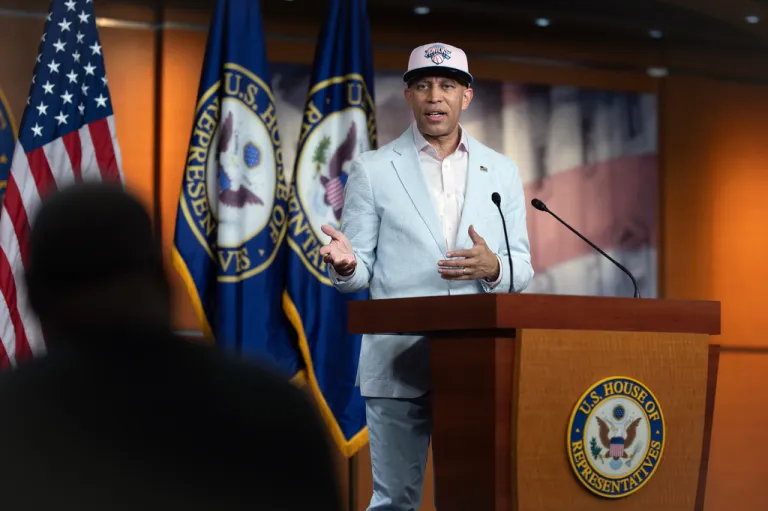 House Minority Leader Hakeem Jeffries, D-N.Y., meets with reporters while wearing a cap for the New York Knicks NBA basketball team on Capitol Hill in Washington, Monday, June 8, 2026. (AP Photo/J. Scott Applewhite)