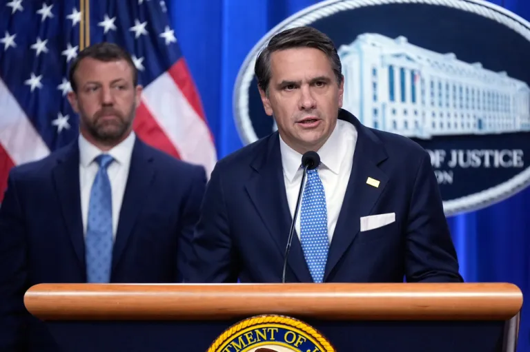 Acting Attorney General Todd Blanche and Homeland Security Secretary Markwayne Mullin speak during a news conference on unaccompanied children at the Justice Department Thursday, June 11, 2026, in Washington. (AP Photo/Manuel Balce Ceneta)