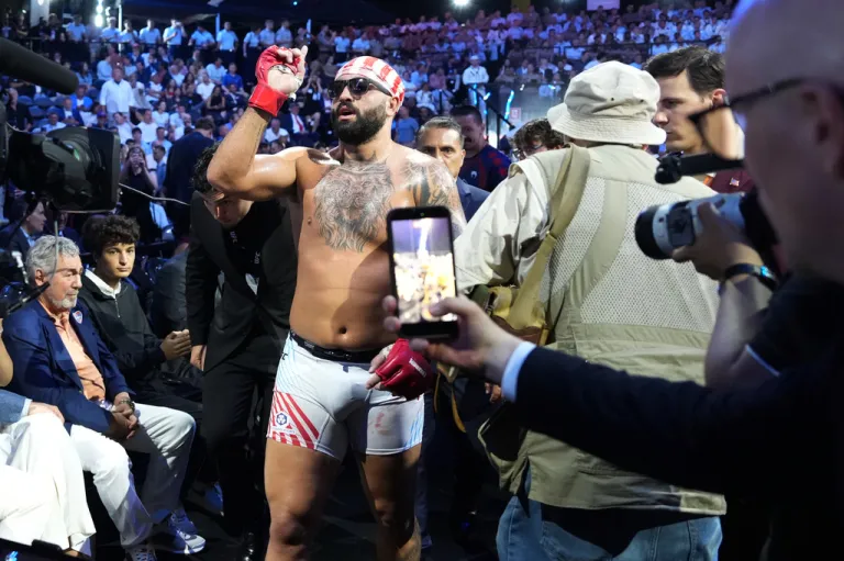 Josh Hokit leaves the ring after winning his fight against Derrick Lewis.