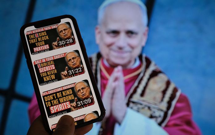 A YouTube account posting AI-generated deepfake audios of Pope Leo XIV in front of a TV screen. AI-generated videos and audios of Pope Leo XIV are populating rapidly online, racking up views as platforms struggle to police them. (CHRIS DELMAS/AFP via Getty Images)