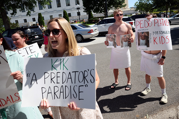 Demonstrators protest outside the Democratic Senatorial Campaign Committee