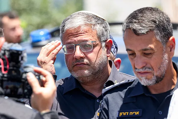 Israel's far-right national security minister Itamar Ben Gvir (C) arrives at the site of a suspected shooting attack in the town of Tzur Yitzhak in central Israel close to the occupied West Bank on June 7, 2026. One person was killed and four others wounded in multiple suspected shooting attacks in Israel on June 7, rescuers and the army said.