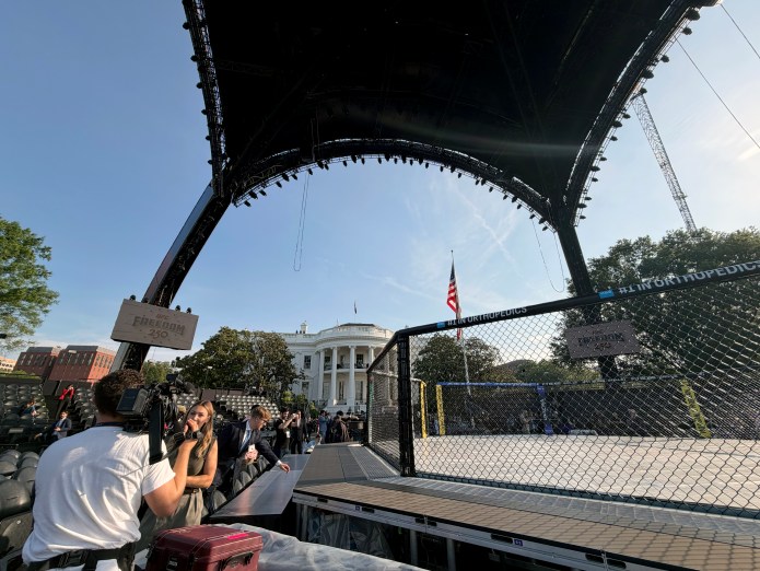 Members of the press gathering their take on the main venue for UFC Freedom 250, ahead of the fight on Sunday, June 14. (Judith Y. Kim/Washington Examiner)
