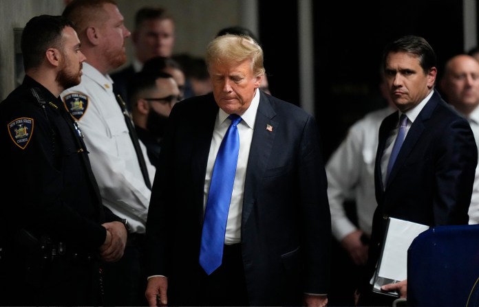 President Donald Trump walks out of a courtroom after a jury convicted him of felony crimes for falsifying business records in a scheme to illegally influence the 2016 election at Manhattan Criminal Court in New York on May 30, 2024. (Seth Wenig/AP)