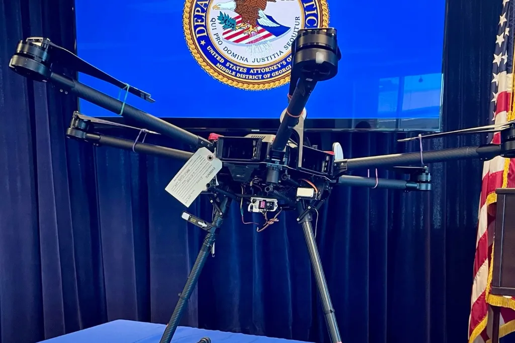 Feds bust a dozen for allegedly smuggling drugs and phones into prisons using heavy payload drone
