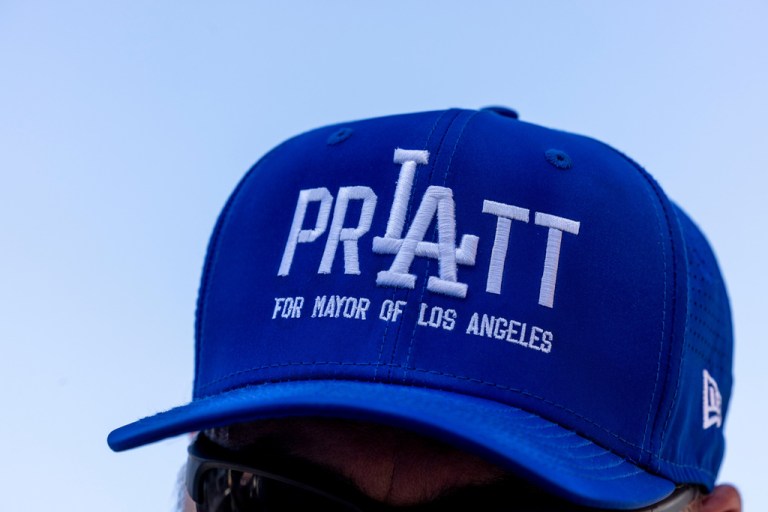 A man wearing a hat supporting Los Angeles mayoral candidate Spencer Pratt during a campaign event.