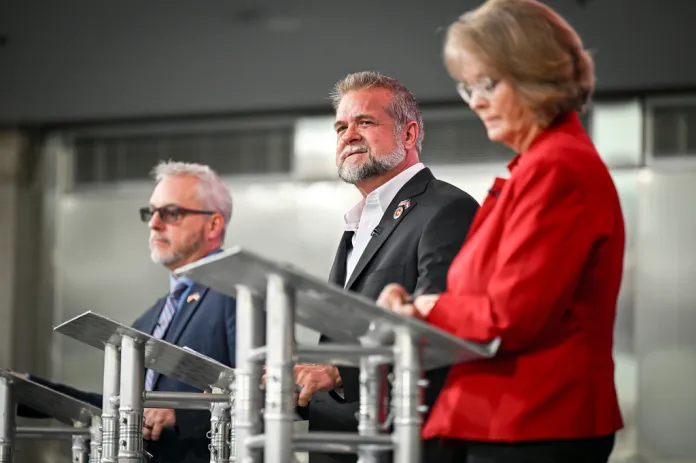 Victor Marx, center, participates in a Republican gubernatorial debate with Colorado state Sen. Barbara Kirkmeyer, right, and Colorado state Rep. Scott Bottoms, left, June 2, 2026, in Denver.